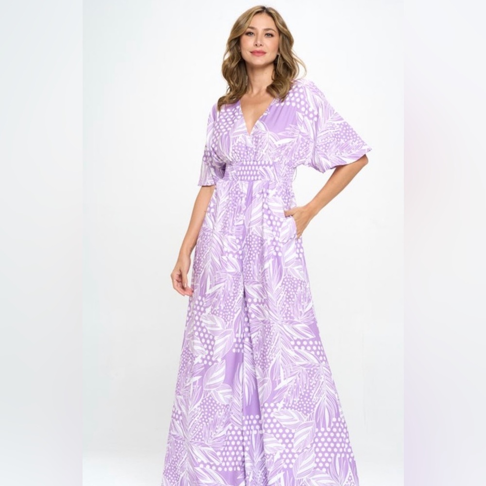 Women’s purple and white wide leg Boho Jumpsuit with front pockets.